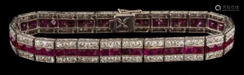 An early 20th century ruby and diamond line bracelet: with central row of calibre-cut rubies
