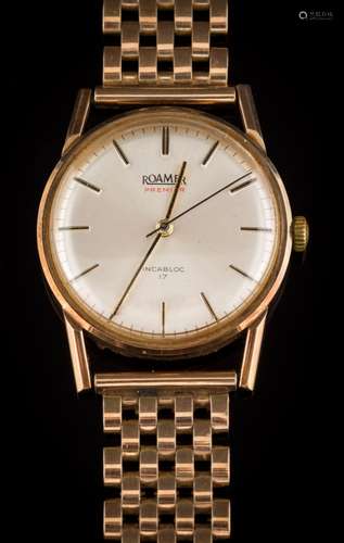 A gentleman's 'Roamer' wristwatch: the circular dial with baton markers and on 9ct gold strap.