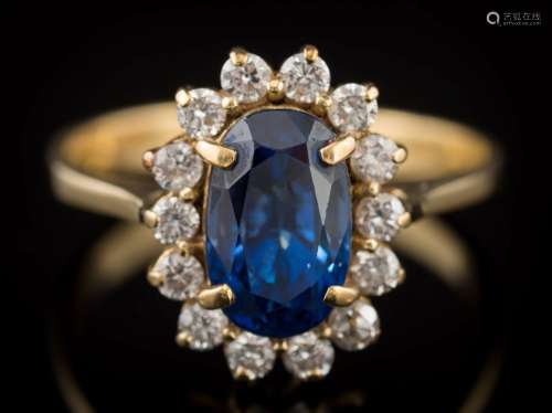 A sapphire and diamond mounted oval cluster ring: with central, oval sapphire approximately 9.