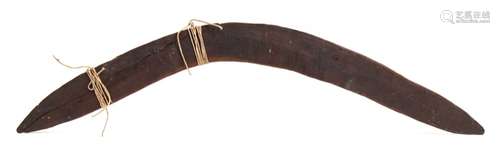 A late 19th century Aboriginal boomerang: of traditional design, 65cm.