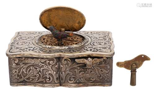 A German silver automaton musical box: the hinged lid enclosing a rotating singing bird,