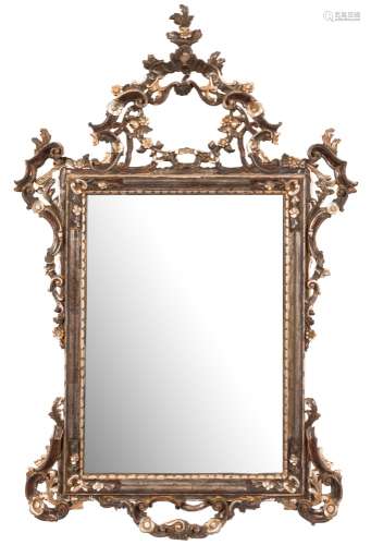 A carved wood and silvered Italianate mirror:, with pierced cartouche,