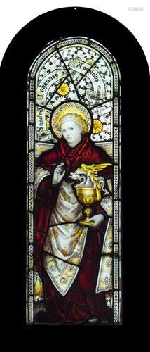 A 19th century stained glass panel, depicting Saint John the Apostle: of arched outline,