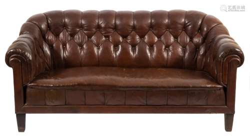 A Swedish Chesterfield style sofa:, fully upholstered in brown buttoned leather,