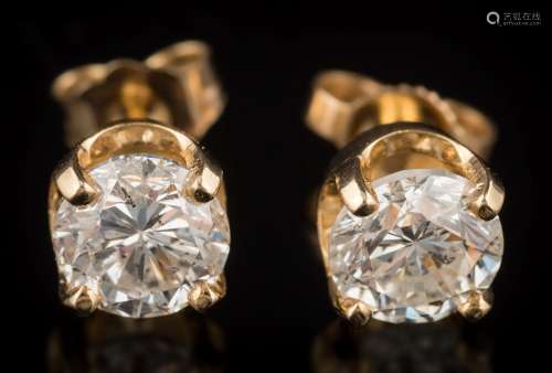 A pair of diamond single-stone ear-studs: each with a circular brilliant-cut diamond approximately