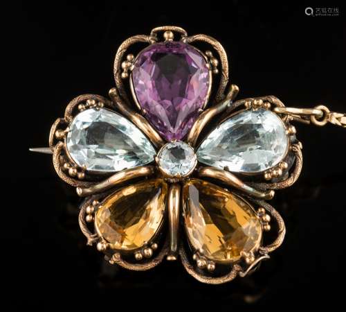 An aquamarine, citrine and amethyst 'pansy' brooch: approximately 30mm long, 7.5gms gross weight.