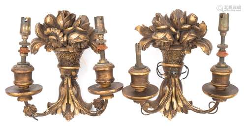 A pair of Continental carved giltwood wall lights: each backplate in the form of a basket of