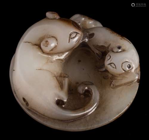 A Chinese jade carving: in the form of a cat and kitten, a moth to the reverse,