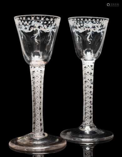 A pair of 'Beilby' white enamelled wine glasses: each with round funnel shaped bowl decorated below