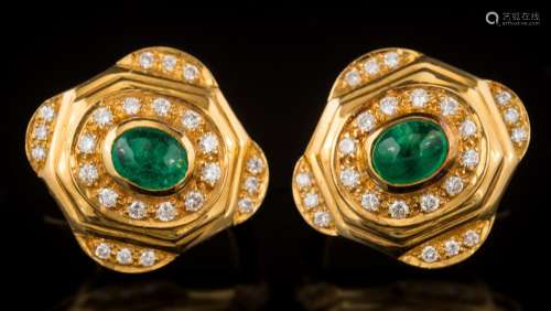 A pair of oval emerald and diamond stud/clip earrings: each centring an oval cabochon emerald