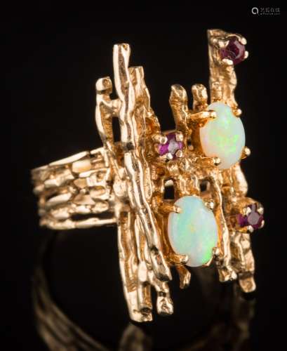 An opal and ruby mounted informal cluster ring: of textured finish,