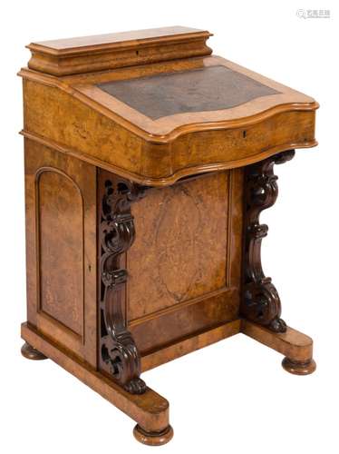 A Victorian walnut and inlaid serpentine fronted Davenport:,