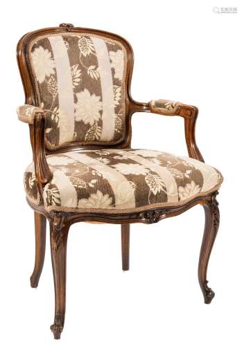 A carved beechwood fauteuil in the Louis XV taste:,