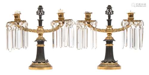 A pair of Regency period gilt bronze twin-branch table lights: with urn-shaped nozzles,