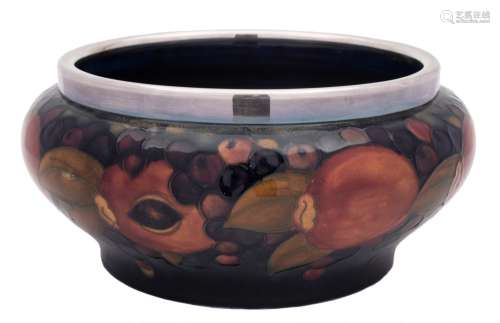A Moorcroft pottery bowl: of squat circular form with plated rim,