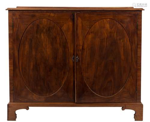 A George III mahogany and inlaid side cupboard:, with a narrow ledge back,