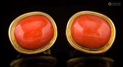 A pair of coral single-stone stud/clip earrings: each cushion shaped coral approximately 16.