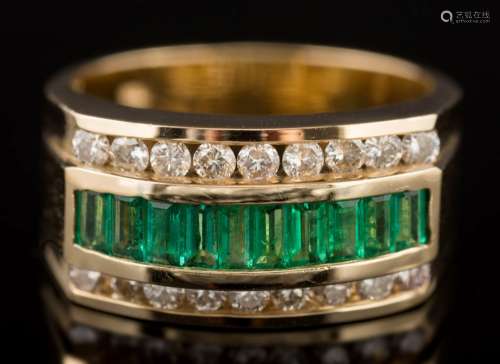 An emerald and diamond three-row cluster ring: with central row of baguette-cut emeralds,