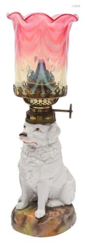 A Continental porcelain table lamp in the form of a dog: seated on a mound base,