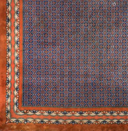 A Turkish carpet:, the indigo lattice field with all over cruciform medallions,