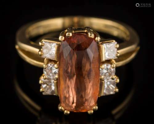 A topaz and diamond cluster ring: with central oval topaz approximately 13mm long x 6.