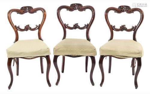 A set of six Victorian carved rosewood dining chairs:,