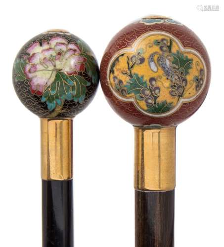 A 20th century ebonised walking stick: with cloisonne enamel ball handle decorated with flowers,