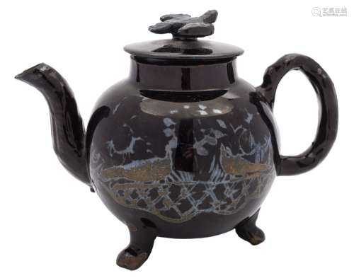 A 'Jackfield' black glazed teapot and cover: with bird finial, crabstock handle and spout,