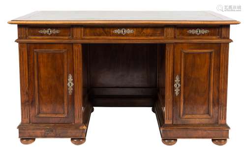 A late 19th/early 20th Century French walnut kneehole desk:,