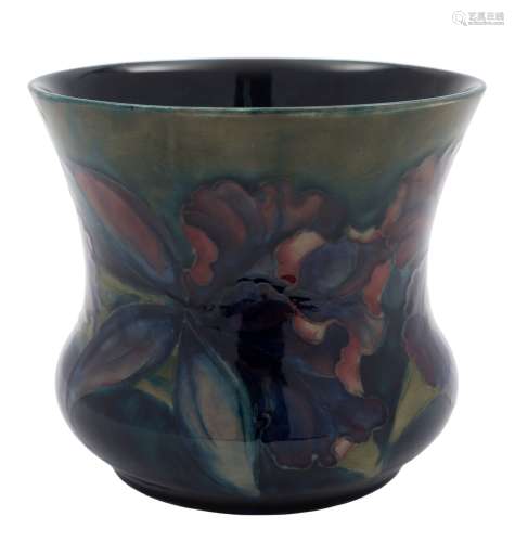 A Moorcroft pottery jardiniere: tube lined in the Iris pattern in shades of blue, green,