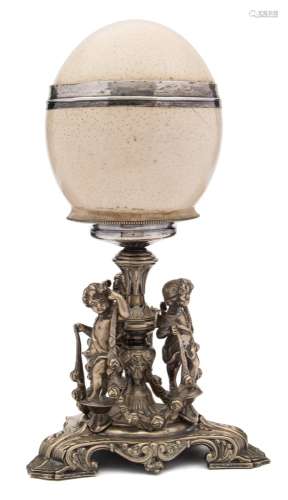 A 19th century ostrich egg table centre piece: the egg with silver girdle,