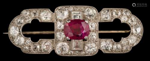 A white metal, ruby and diamond oblong brooch: with central single,