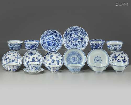 A GROUP OF CHINESE BLUE AND WHITE CUPS AND SAUCERS