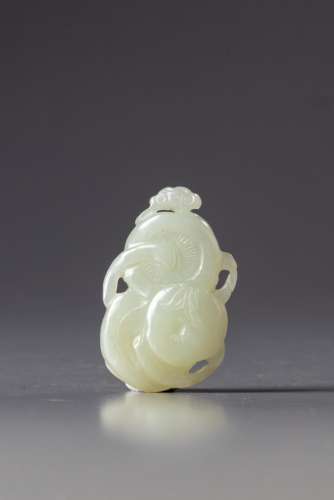 A CHINESE WHITE JADE 'PERSIMMON AND DRAGONFLY' CARVING