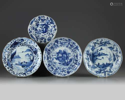 FOUR CHINESE BLUE AND WHITE FOLIATE-RIMMED 'SCHOLAR LANDSCAPE' DISHES