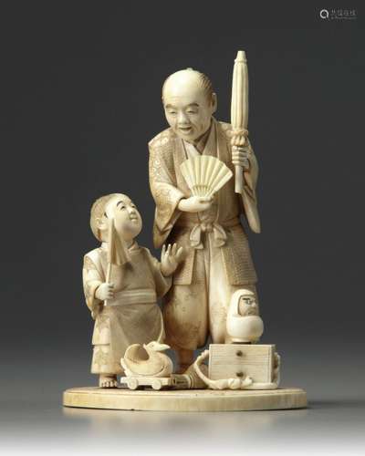 AN IVORY OKIMONO OF FATHER AND SON