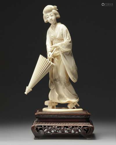 AN IVORY CARVING OF A GEISHA HOLDING A PARASOL