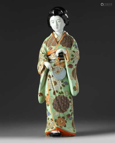 A JAPANESE GREEN ENAMELLED PORCELAIN FIGURE OF A LADY