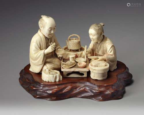 A JAPANESE CARVED IVORY OKIMONO GROUP