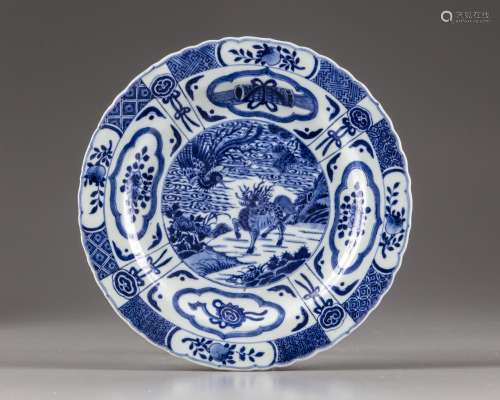 A CHINESE BLUE AND WHITE 'QILIN AND PHOENIX' DISH
