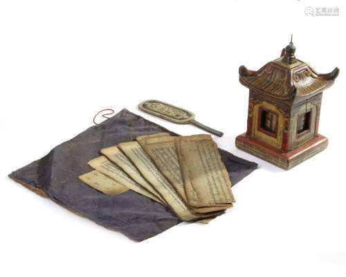 A SMALL MONGOLIAN LEATHER BAG, THREE MANUSCRIPT SECTIONS AND A WOODEN PRAYER WHEEL