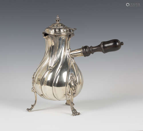 A large mid-18th century French silver coffee pot of writhen baluster form with hinged dome lid