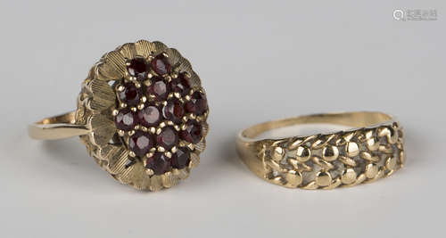 A 9ct gold and garnet oval cluster ring, ring size approx O, and a 9ct gold keeper ring in an