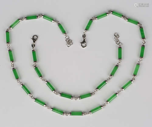 A silver mounted reconstituted jade necklace, formed as a series of baton shaped links on a sprung