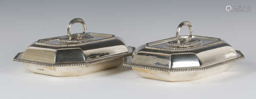 A pair of Edwardian silver rectangular entrées dishes, covers and handles, with canted corners and
