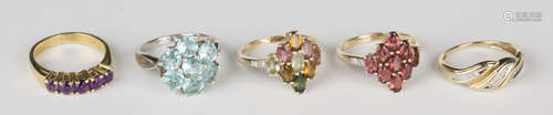 A 9ct gold and diamond ring in a three row slanting design, an amethyst five stone ring, a 9ct