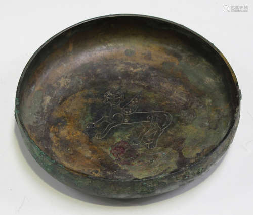 A Medieval Islamic Seljuk green patinated bronze bowl, circa 12th-13th century AD, the interior