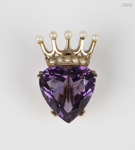 A 9ct gold, amethyst and seed pearl brooch, designed as a heart shaped amethyst surmounted by a seed