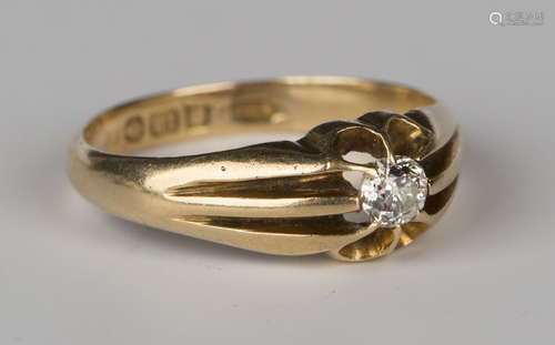 An 18ct gold and diamond single stone ring, gypsy set with a cushion shaped diamond, Birmingham