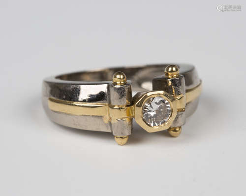 A French two colour gold and diamond single stone ring, mounted with the circular cut diamond within